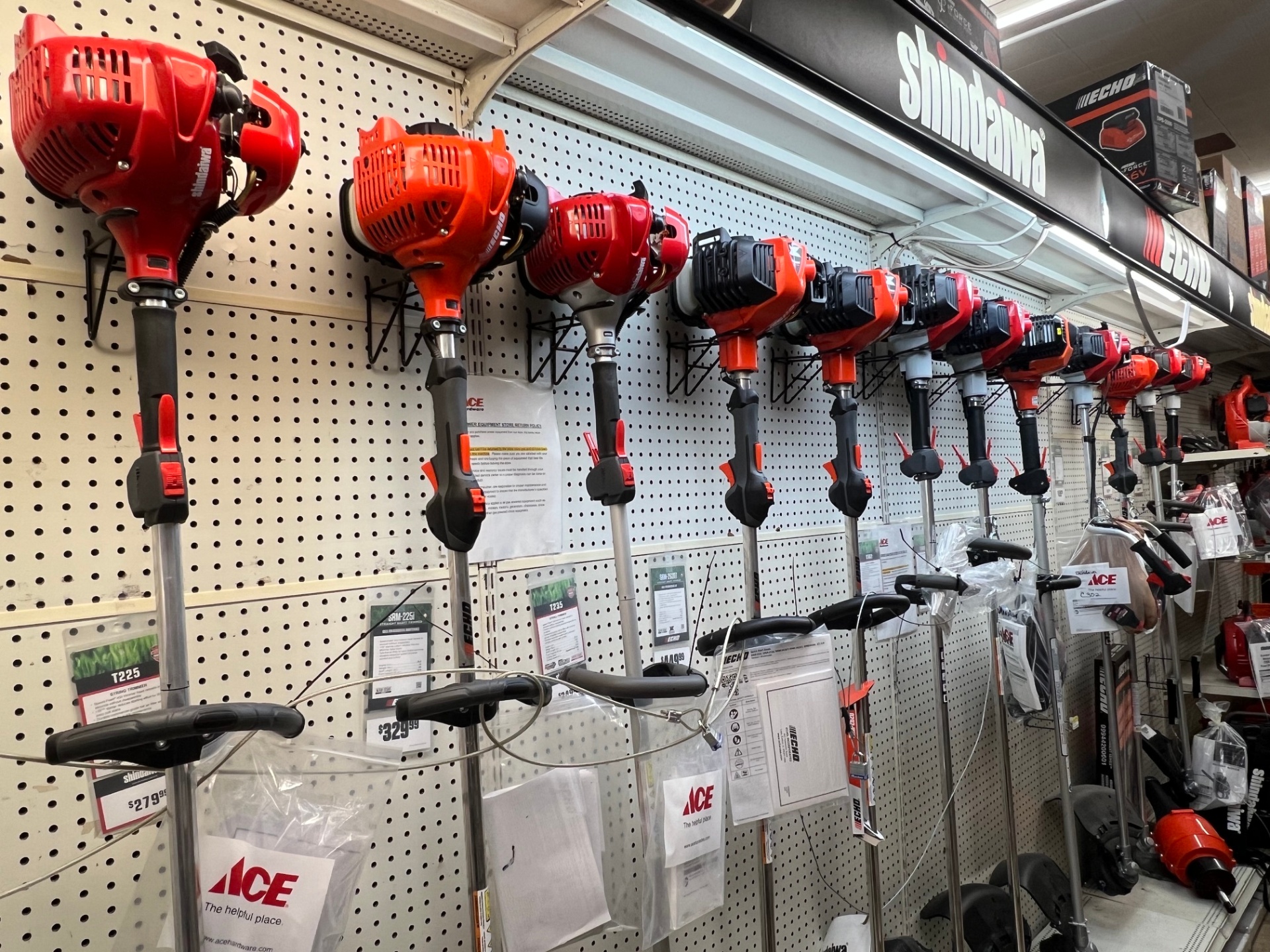 Echo and Shindaiwa trimmers on the wall at Center Hardware